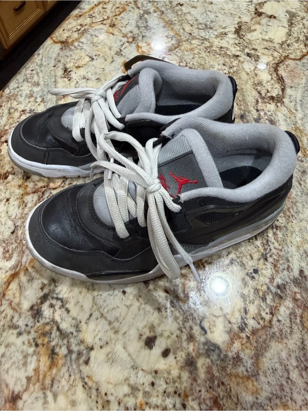 Nike Kids Jordan 4 Black and Gray Sneakers with Red Logo